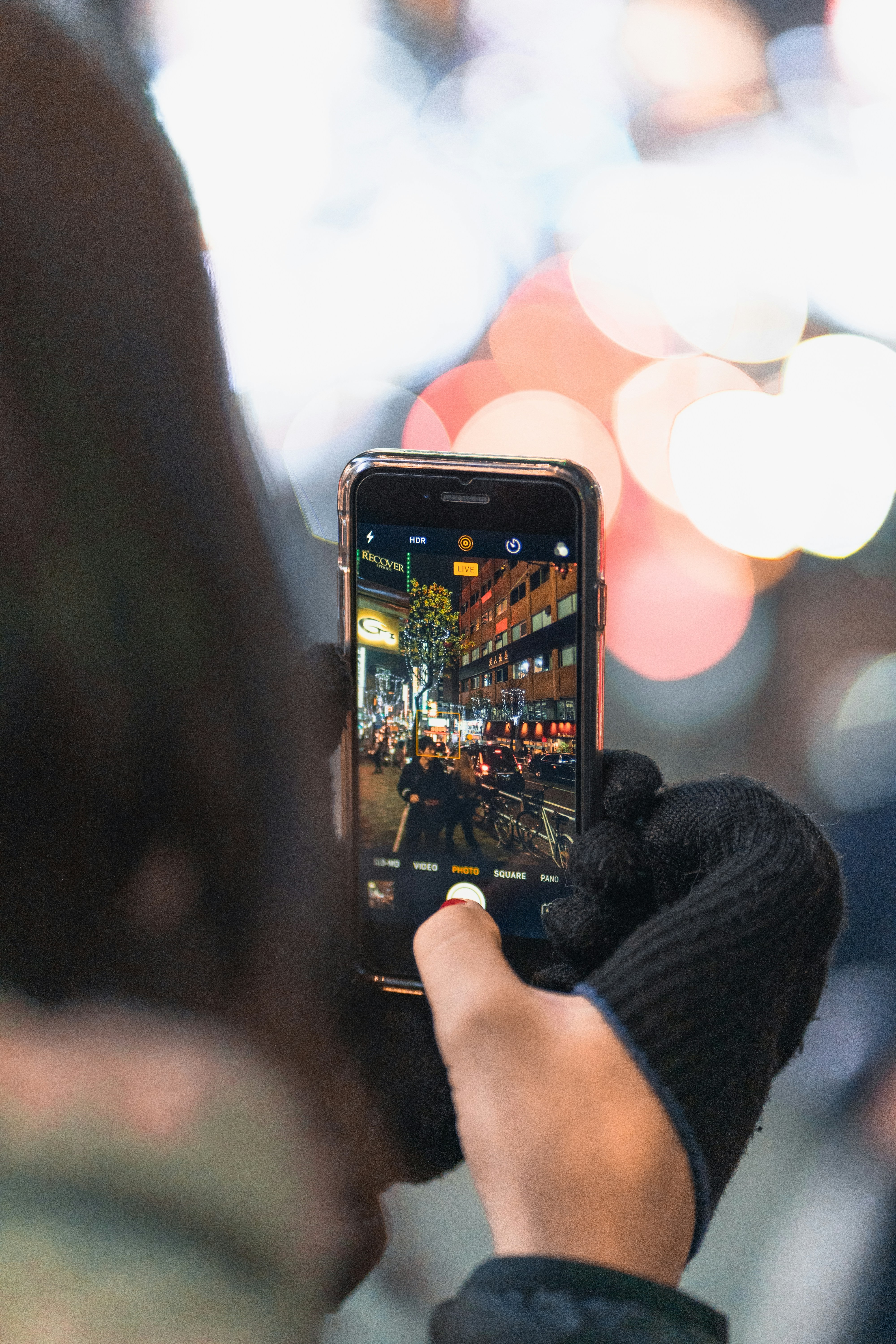 Traveler using smartphone at night representing reliable global eSIM connectivity
