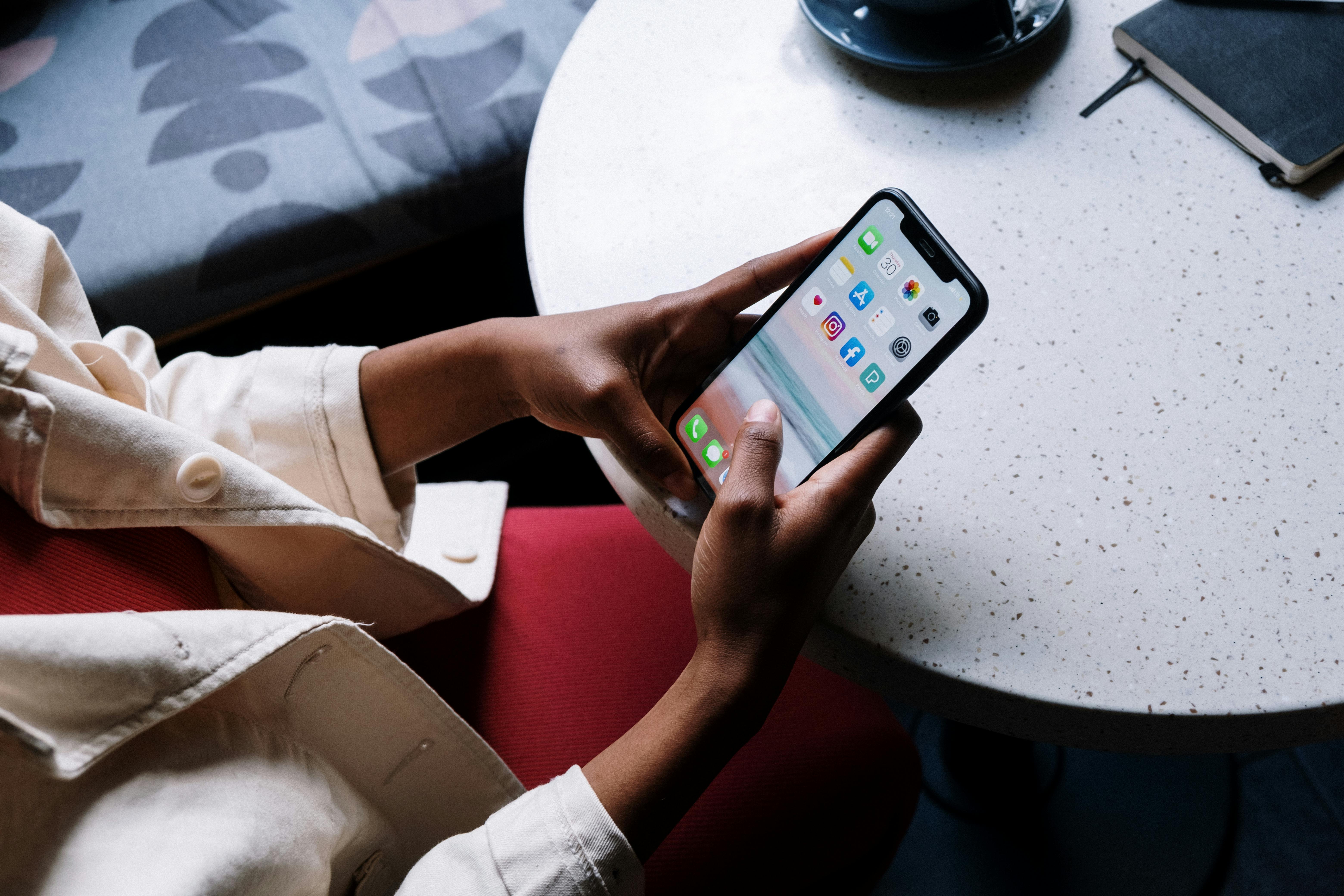 person on mobile phone, sitting down
