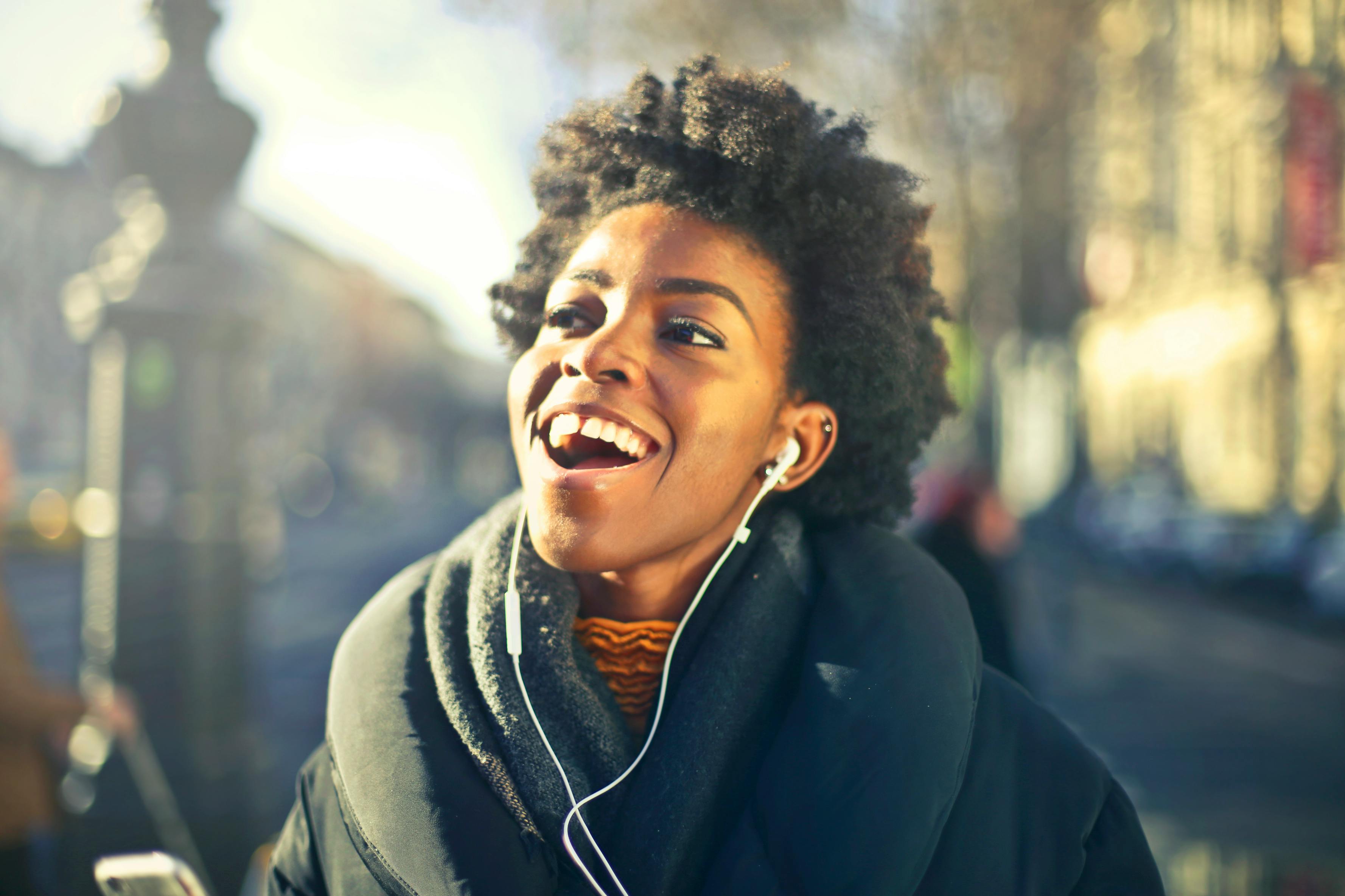 person laughing, on head phones