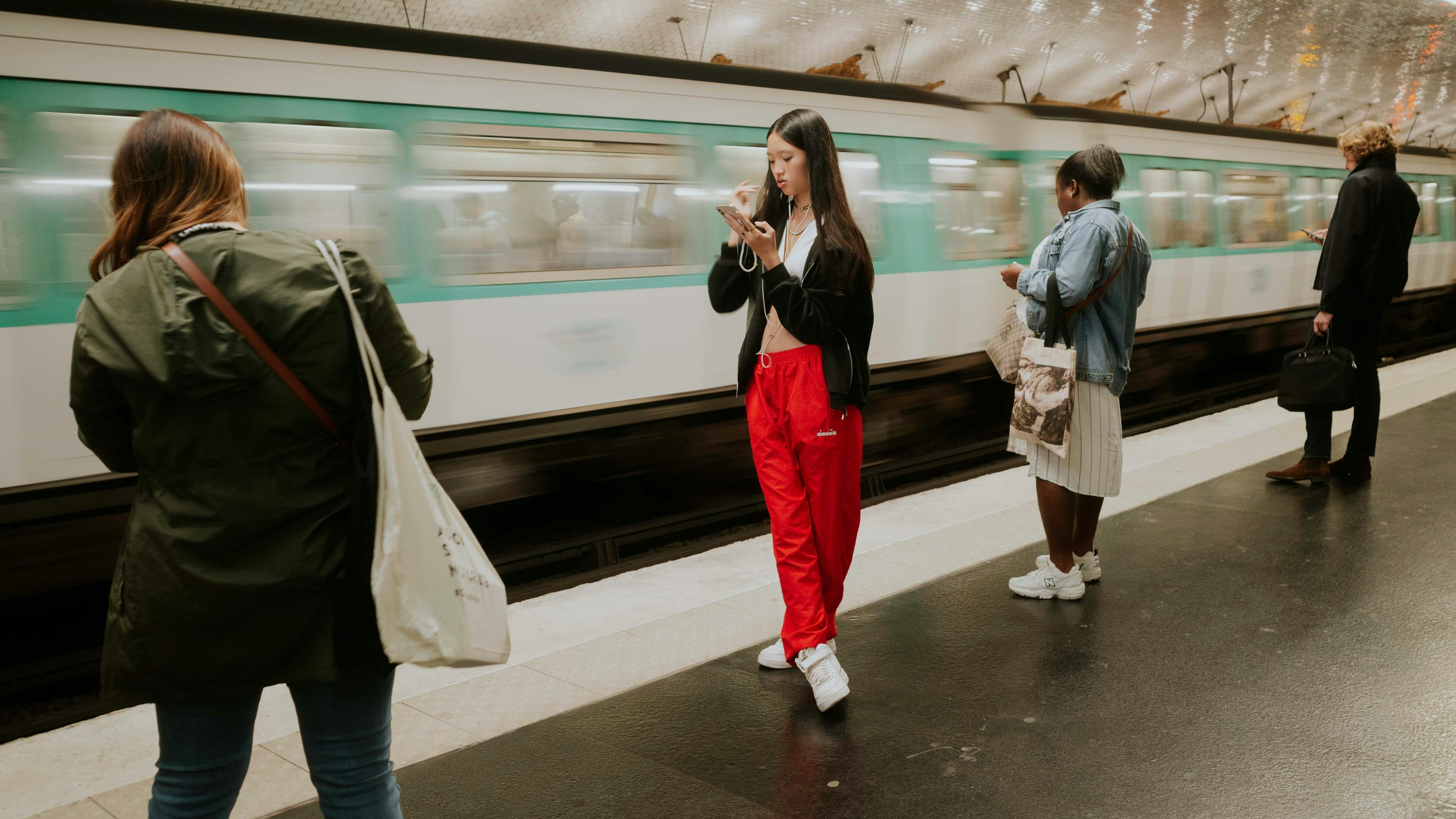 people in subway/metro on their mobile phones